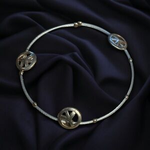 Two tone peace sign cable wire bracelet